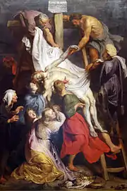 Le Christ est descendu de la croix entouré de dix personnages, dont trois hommes juchés sur des échelles, et trois femmes au pied de la croix.